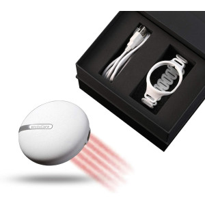 Female using red and white device for pain relief on her back.