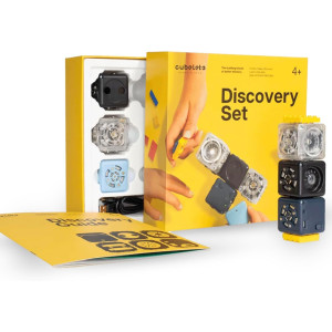 Colorful Cubelets Discovery Set with interactive blocks and guidebook on yellow background.